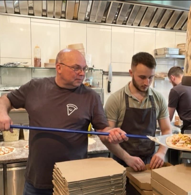 The founder and his father in the family restaurant kitchen
